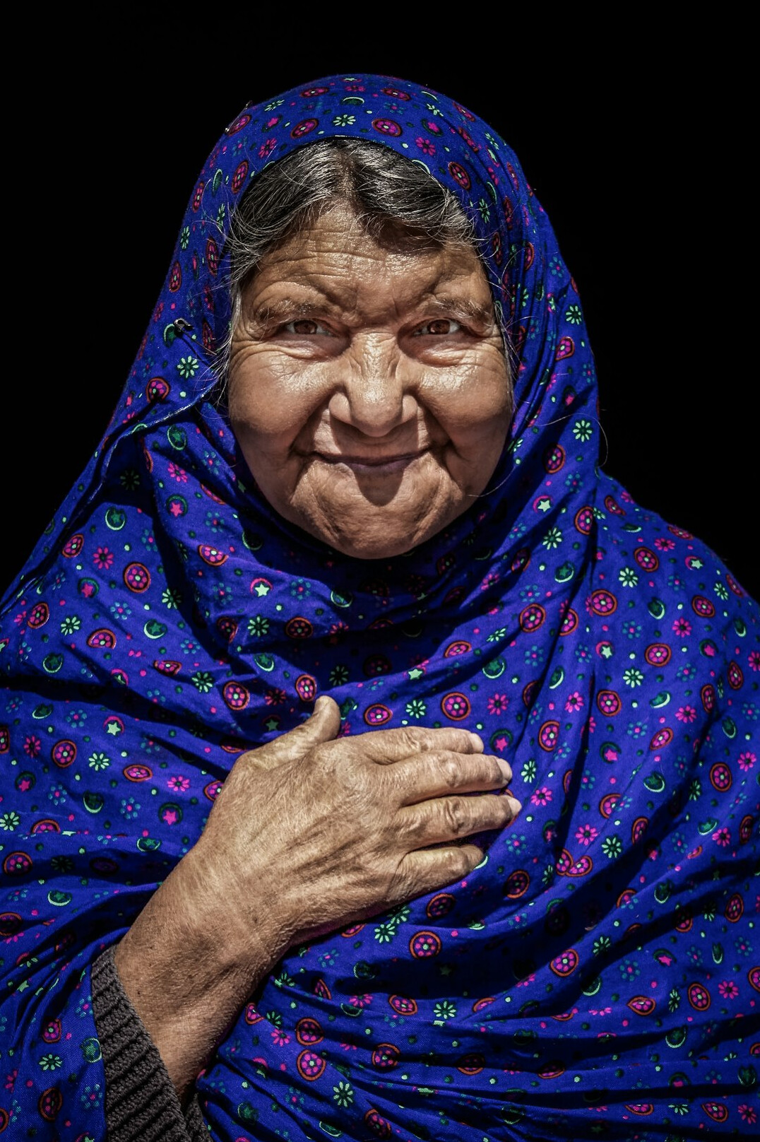 Studio portrait of a smiling older woman