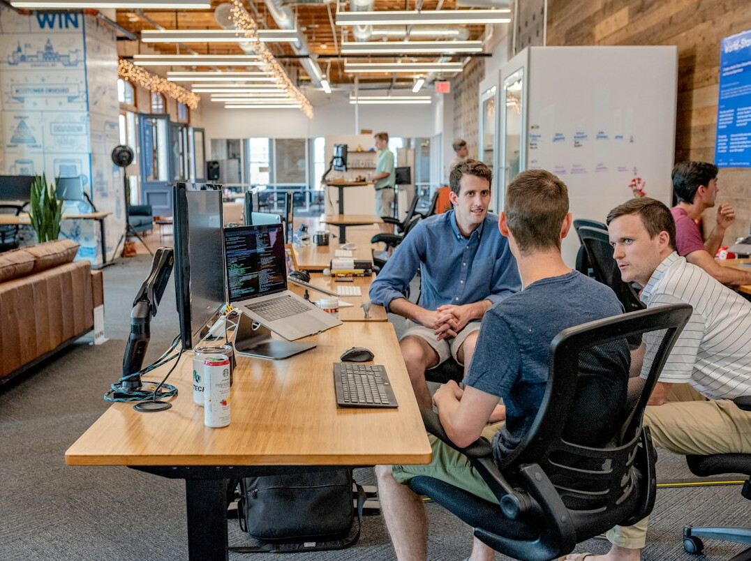 team discussing insurance software