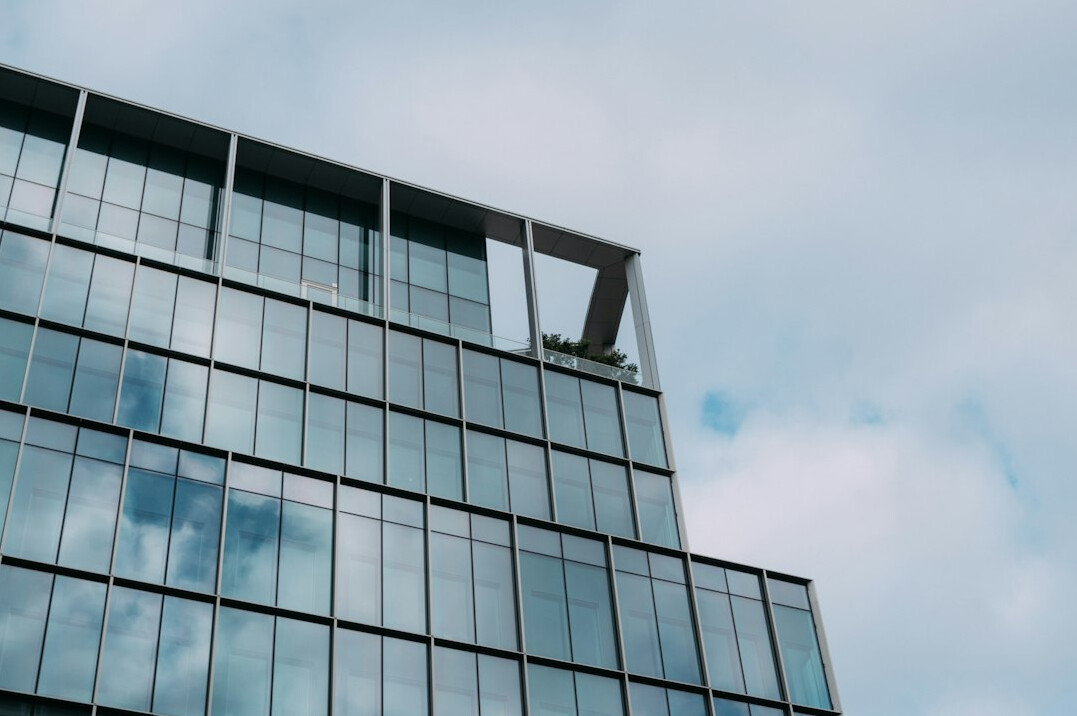 Modern glass office building exterior in daylight