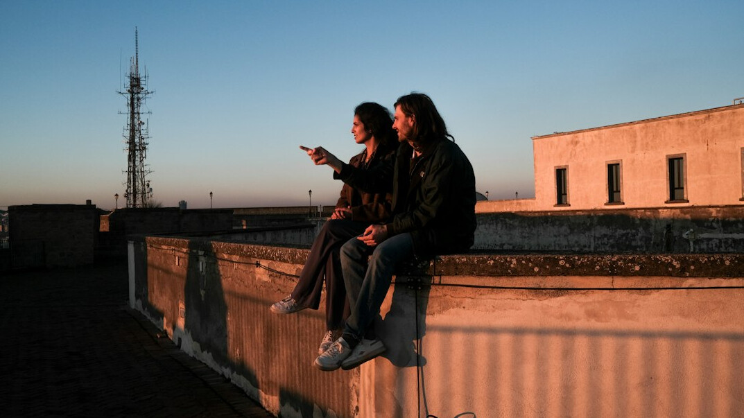 Two colleagues discussing a chart on a tablet