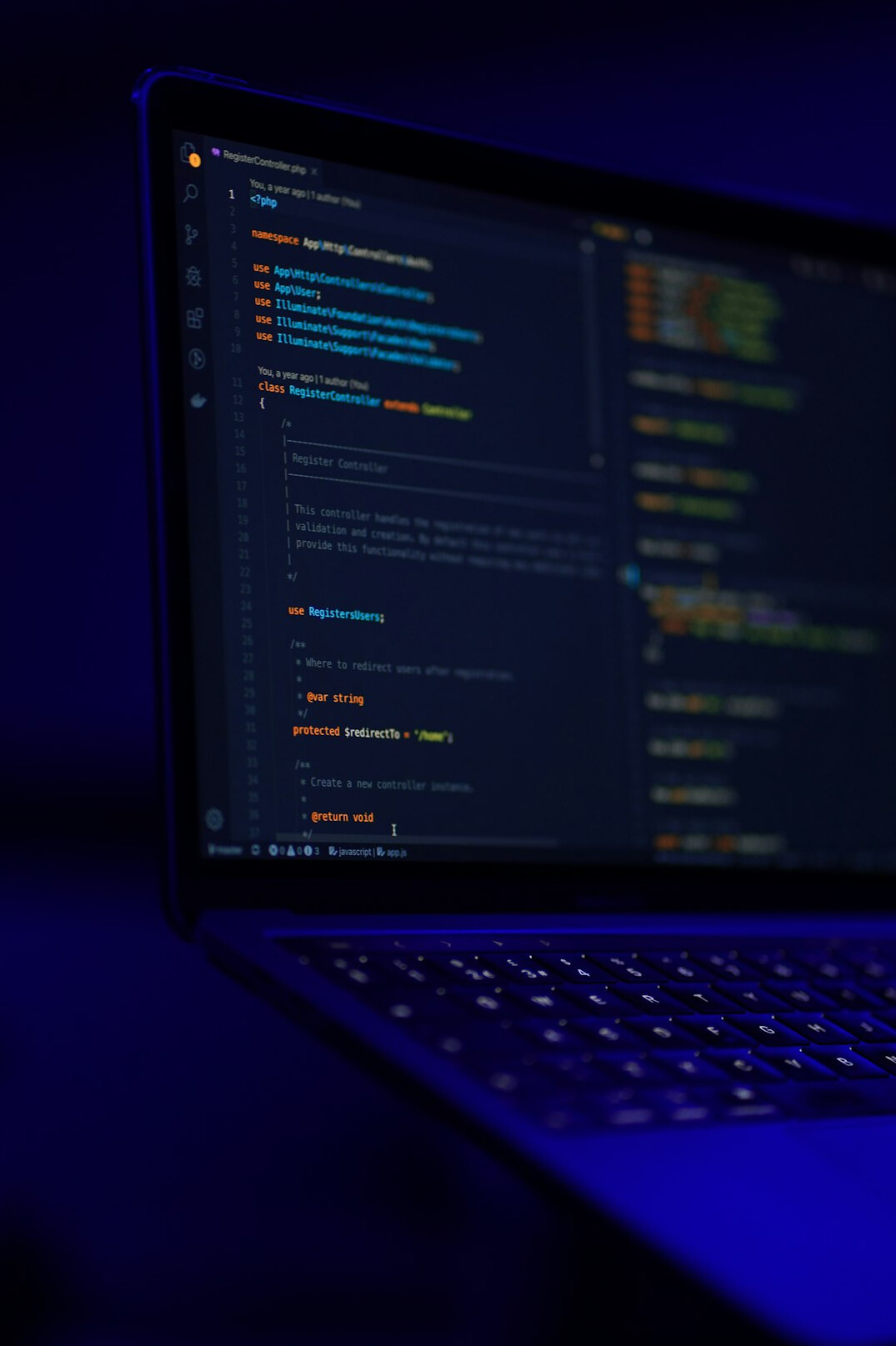 programmer coding at laptop